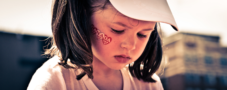 girl with canada day face sticker