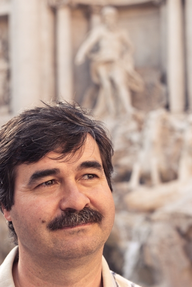 man in front of Trevi Fountain