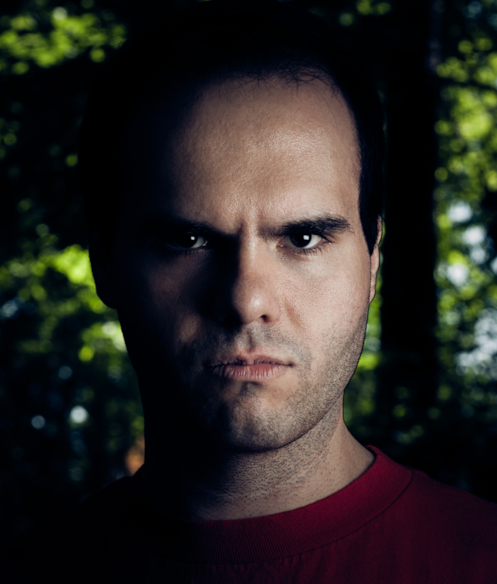 young man in a dark forest