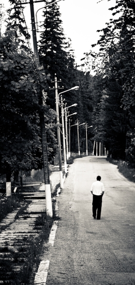 man walking down a street